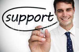 Businessman writing the word support