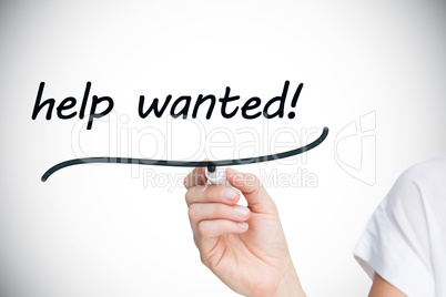 Businesswoman writing the words help wanted