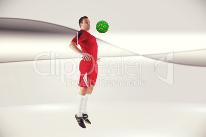 Composite image of football player in red jumping