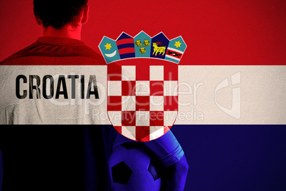 Composite image of croatia football player holding ball