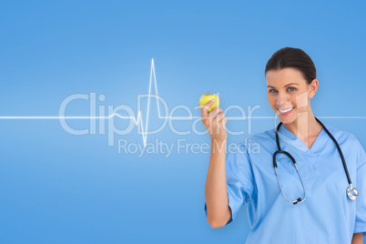 Composite image of happy surgeon holding an apple and smiling at camera