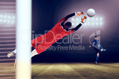 Composite image of goalkeeper in red jumping up