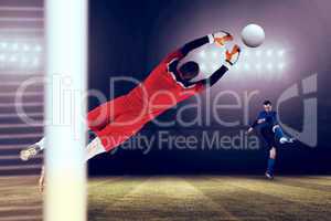 Composite image of goalkeeper in red jumping up