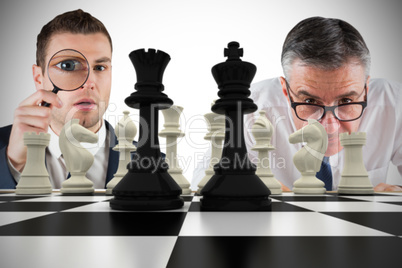 Composite image of business people with chessboard