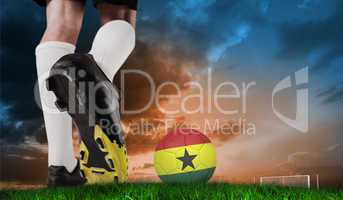 Composite image of football boot kicking ghana ball