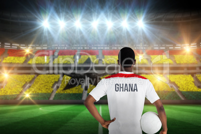 Composite image of ghana football player holding ball