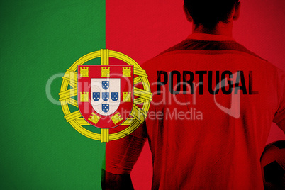 Composite image of portugal football player holding ball