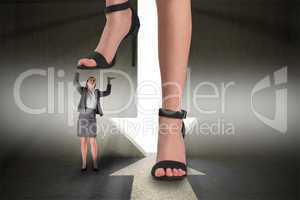 Composite image of female feet in black sandals standing on busi
