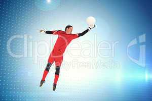 Composite image of fit goal keeper jumping up