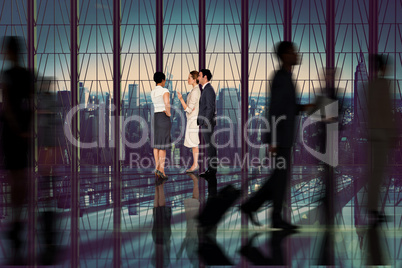 Composite image of business colleagues talking