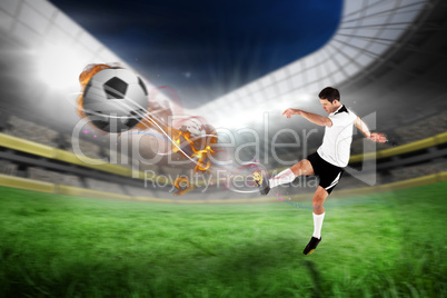 Composite image of football player in white kicking