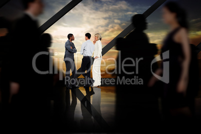 Composite image of business people walking in a blur