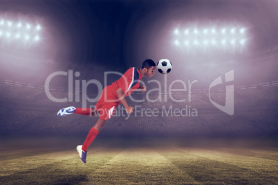 Composite image of football player in red jumping