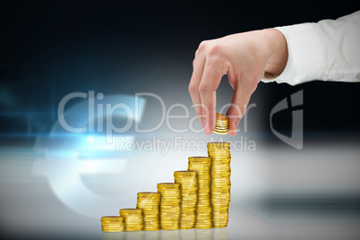 Composite image of businessman holding coins
