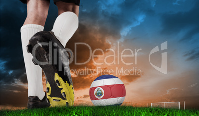 Composite image of football boot kicking costa rica ball