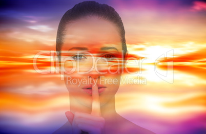 Composite image of beautiful brunette making quiet gesture