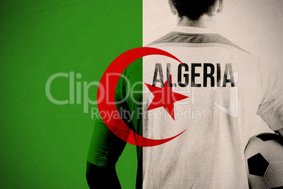 Composite image of algeria football player holding ball