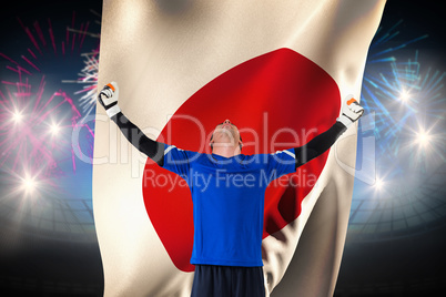 Composite image of goalkeeper celebrating a win