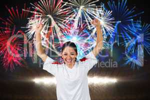 Composite image of football fan in white cheering