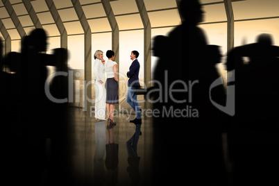 Composite image of silhouette of business people walking