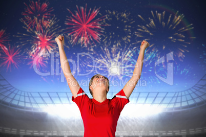 Composite image of cheering football fan in red