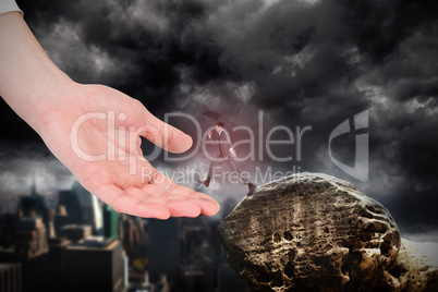 Composite image of businessman jumping holding an umbrella on la