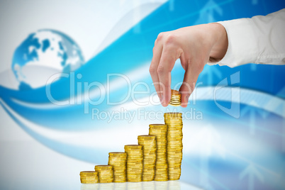 Composite image of businessman holding coins