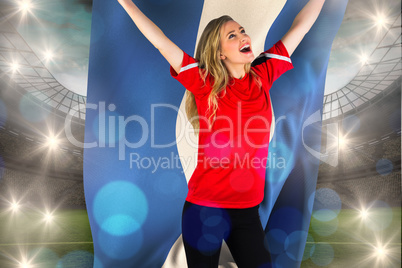Composite image of cheering football fan in red holding honduras