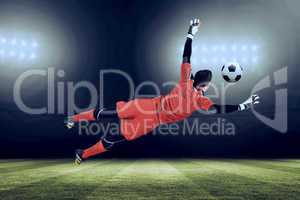 Composite image of fit goal keeper jumping up