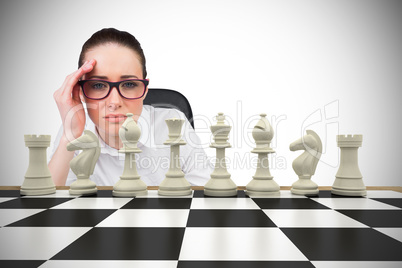 Composite image of thinking businesswoman