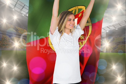 Composite image of pretty football fan in white cheering holding