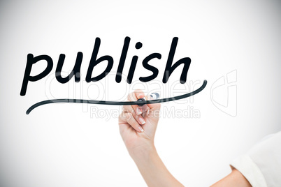 Businesswoman writing the word publish