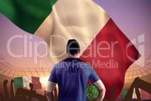 Composite image of italy football player holding ball