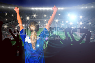 Composite image of cheering football fan in blue