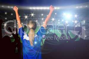 Composite image of cheering football fan in blue