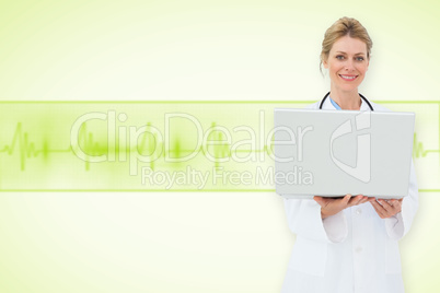 Composite image of blonde doctor using laptop