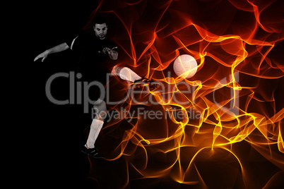 Composite image of football player in red kicking