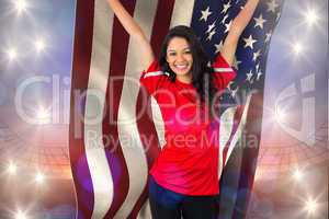 Composite image of cheering football fan in red holding usa flag
