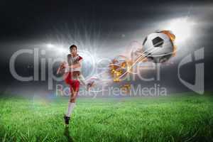 Composite image of football player in white kicking