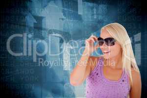 Composite image of blond woman with sunglasses