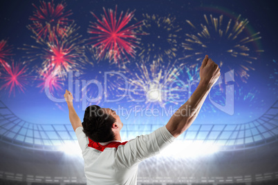 Composite image of excited football fan cheering