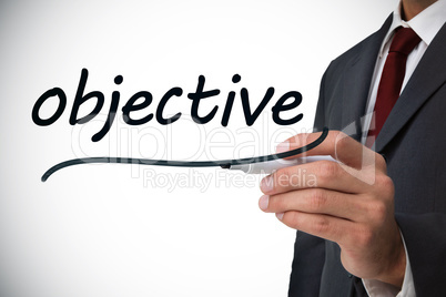 Businessman writing the word objective