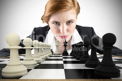 Composite image of focused businesswoman