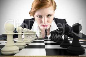 Composite image of focused businesswoman