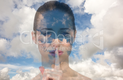 Composite image of beautiful brunette making quiet gesture