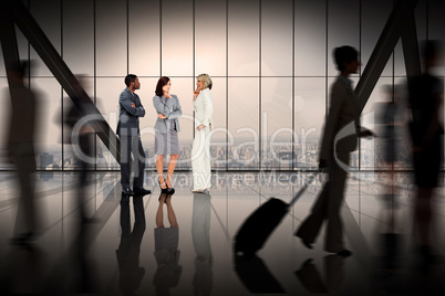 Composite image of business colleagues talking