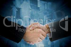 Composite image of business people shaking hands