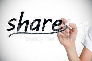 Businesswoman writing the word share