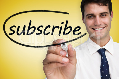 Businessman writing the word subscribe