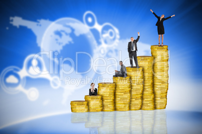 Composite image of business people on pile of coins